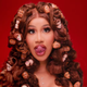 Image for article titled Cardi B Using a White Man As a Table, and Other Important Moments from the 'Up' Video